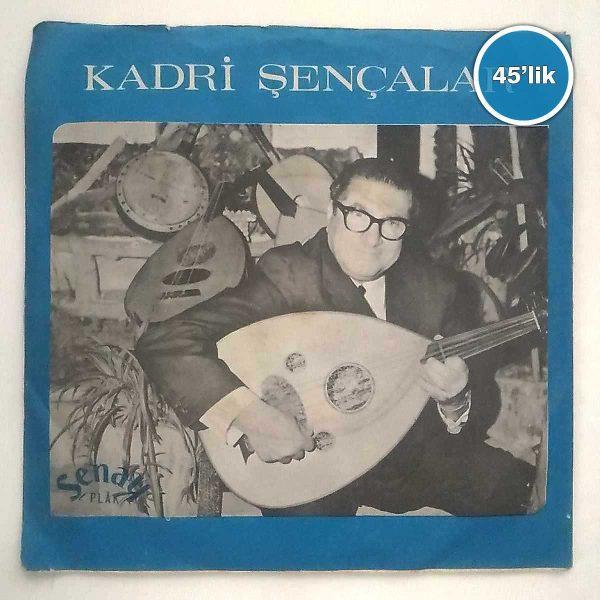Film Müzik KADRİ ŞENÇALAR – Ud’la Kalenin Bedenleri – Ud’la Adananın Yolları Taştan – 45lik Plak Sahhaf.Net KADRİ ŞENÇALAR – Ud’la Kalenin Bedenleri – Ud’la Adananın Yolları Taştan – 45lik Plak Sahhaf.Net Film Müzik